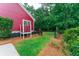 A beautiful backyard with lush green grass, colorful plants, and a fence for added privacy at 208 Molasses Mill Ct, Summerville, SC 29485
