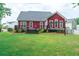 View of the backyard, patio, and white picket fence at 208 Molasses Mill Ct, Summerville, SC 29485