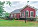 A backyard view showing the wood deck with stairs to the grass, and black iron fence at 208 Molasses Mill Ct, Summerville, SC 29485