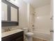 Bathroom with modern fixtures, a shower-tub combo, wood plank flooring, and dark vanity cabinet at 208 Molasses Mill Ct, Summerville, SC 29485