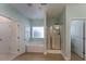 Bathroom with a soaking tub, glass-enclosed shower and wood look flooring at 208 Molasses Mill Ct, Summerville, SC 29485