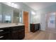 Bathroom featuring double vanities, wood look floors, a glass-enclosed shower and spacious layout at 208 Molasses Mill Ct, Summerville, SC 29485