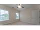 Comfortable bedroom with natural light from two windows and a ceiling fan at 208 Molasses Mill Ct, Summerville, SC 29485