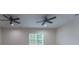 Bedroom featuring a modern ceiling fan, neutral walls, and a bright window at 208 Molasses Mill Ct, Summerville, SC 29485