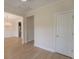 An open dining room with wood floors, wainscoting, a chandelier, and seamless transition to the kitchen at 208 Molasses Mill Ct, Summerville, SC 29485