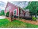 Back exterior view of the house with a deck at 208 Molasses Mill Ct, Summerville, SC 29485