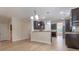 Kitchen offers open floorplan with granite countertops, dark wood cabinetry and stainless appliances at 208 Molasses Mill Ct, Summerville, SC 29485