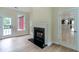 Cozy living room with a fireplace and hardwood floors at 208 Molasses Mill Ct, Summerville, SC 29485