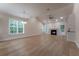 Bright living room features vaulted ceilings, ample natural light, and modern finishes at 208 Molasses Mill Ct, Summerville, SC 29485
