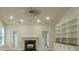 Living room showcasing a fireplace and a custom built-in bookcase at 208 Molasses Mill Ct, Summerville, SC 29485