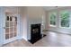 Living room featuring a fireplace and glass paneled doors at 208 Molasses Mill Ct, Summerville, SC 29485