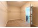 Walk-in closet with carpet, wire shelving, and open doorway at 208 Molasses Mill Ct, Summerville, SC 29485