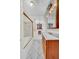 Bright bathroom features tile floors, glass shower doors, and marble top vanity at 210 Padgett Loop, Walterboro, SC 29488