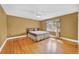 Spacious bedroom with hardwood floors, ceiling fan, and a bright window at 210 Padgett Loop, Walterboro, SC 29488