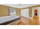 Bedroom with natural light, hardwood floors, and a window with decorative curtains at 210 Padgett Loop, Walterboro, SC 29488