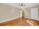 Bedroom features hardwood floors, neutral colored walls, two doors and a ceiling fan at 210 Padgett Loop, Walterboro, SC 29488