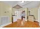 Spacious bonus room featuring hardwood floors, neutral colored walls, and washer dryer hook ups at 210 Padgett Loop, Walterboro, SC 29488