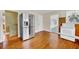 Bright kitchen with stainless steel refrigerator, updated appliances, and hardwood floors at 210 Padgett Loop, Walterboro, SC 29488
