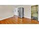 Bright kitchen area featuring a stainless steel refrigerator and hardwood floors at 210 Padgett Loop, Walterboro, SC 29488