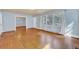 Bright living room with hardwood floors, offering seamless flow into adjacent rooms at 210 Padgett Loop, Walterboro, SC 29488