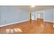 Well-lit living room with hardwood floors, showcasing a versatile and open floor plan at 210 Padgett Loop, Walterboro, SC 29488