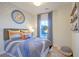 Charming bedroom featuring space-themed decor and blue striped bedding, creating a fun and inviting atmosphere at 213 Clearpath Dr, Summerville, SC 29486