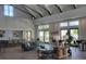 Inviting clubhouse lounge area with high ceilings, stylish decor, a kitchenette, and ample seating for gatherings at 213 Clearpath Dr, Summerville, SC 29486