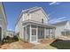 Charming two-story home with a screened-in porch, set in a neatly landscaped yard at 213 Clearpath Dr, Summerville, SC 29486