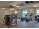 Well-equipped fitness center with modern exercise machines, fans, and large windows providing a bright workout space at 213 Clearpath Dr, Summerville, SC 29486