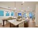 Open-concept kitchen featuring an island and sink, with a view of the dining and living areas at 213 Clearpath Dr, Summerville, SC 29486
