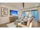 Comfortable living room featuring a ceiling fan, a modern media center, and sliding door access to the patio at 213 Clearpath Dr, Summerville, SC 29486