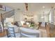 Cozy living room with hardwood floors seamlessly connects to the kitchen and dining area at 213 Clearpath Dr, Summerville, SC 29486