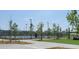 Scenic park with a paved walking path, trees, lighting, and a pickleball court offering a relaxing outdoor space at 213 Clearpath Dr, Summerville, SC 29486