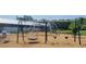 Community playground with swings, climbing structure, and play area promoting fun and active outdoor recreation at 213 Clearpath Dr, Summerville, SC 29486