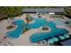 Stunning aerial view of a community pool area with multiple pools, lounge chairs, and lush landscaping at 213 Clearpath Dr, Summerville, SC 29486