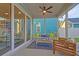 Inviting covered porch with comfortable seating, ideal for relaxation and enjoying the outdoors at 213 Clearpath Dr, Summerville, SC 29486