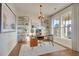 Bright and spacious study with large windows, modern shelving, and hardwood floors at 213 Clearpath Dr, Summerville, SC 29486