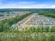 An aerial view of a vibrant residential area surrounded by green space, offering a peaceful suburban setting at 219 Whirlaway Dr, Moncks Corner, SC 29461