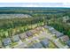 An aerial view showing orderly streets and charming homes surrounded by nature, a balanced neighborhood environment at 219 Whirlaway Dr, Moncks Corner, SC 29461