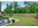 A spacious fenced backyard with a small patio, ideal for outdoor activities and relaxation at 219 Whirlaway Dr, Moncks Corner, SC 29461