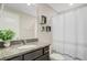 Bathroom featuring a granite vanity, modern decor and shower with patterned curtain at 219 Whirlaway Dr, Moncks Corner, SC 29461