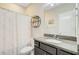 Well-lit bathroom with granite counters, a round shelf, and a shower/tub combo at 219 Whirlaway Dr, Moncks Corner, SC 29461