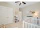 Well-organized Bedroom featuring a crib, changing table, closet, and cozy decor at 219 Whirlaway Dr, Moncks Corner, SC 29461