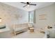 Charming Bedroom featuring a crib, glider, soft decor, and natural light at 219 Whirlaway Dr, Moncks Corner, SC 29461