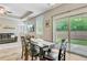 Bright dining area with patio access, seamlessly integrated with the living room and backyard views at 219 Whirlaway Dr, Moncks Corner, SC 29461