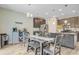 Open dining area features wood floors, pendant lighting, and flows seamlessly into the kitchen at 219 Whirlaway Dr, Moncks Corner, SC 29461