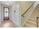 Inviting entryway features a wood door, staircase, and light wood-look floors at 219 Whirlaway Dr, Moncks Corner, SC 29461