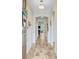 Inviting foyer featuring wood-look floors, arched doorways, and modern lighting at 219 Whirlaway Dr, Moncks Corner, SC 29461