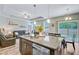 Bright and open kitchen island overlooking the living area and dining area with backyard view at 219 Whirlaway Dr, Moncks Corner, SC 29461