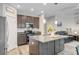 Well-equipped kitchen with granite countertops, stainless appliances, and an open layout to the living area at 219 Whirlaway Dr, Moncks Corner, SC 29461
